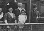 Young J.W. on a boat with parents